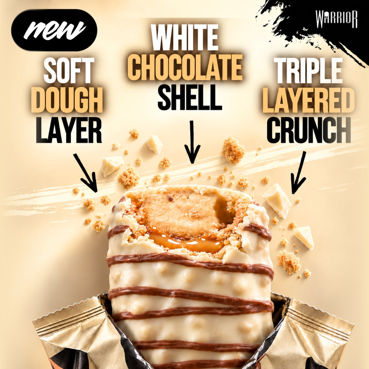 Warrior Crunch White Chocolate protein bar, cut open to show the soft dough layer, white chocolate shell and triple-layered crunch with a caramel centre, wrapper partially peeled back on a beige background with cookie crumb and white chocolate pieces.