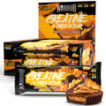 Warrior Chocolate Peanut Creatine Protein Bar box and stacked bars displayed beside an opened peanut butter cup