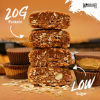 Cross-section stack of Chocolate Peanut Butter RAW bar pieces showing visible oats, with 20G Protein and Low Sugar callouts, peanut butter cups in background