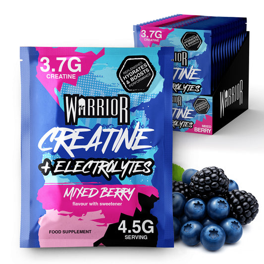 Warrior Creatine + Energy sachets in Mixed Berry flavour displayed with fresh berries. The packaging highlights 3.5g creatine and high caffeine content, showing 15-pack retail box design for performance and energy boost.