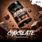 A tub of Warrior Serious Protein Chocolate Milkshake flavour protein powder floating diagonally over a dark chocolate background with floating chocolate chunks and large 'CHOCOLATE' text at the bottom.