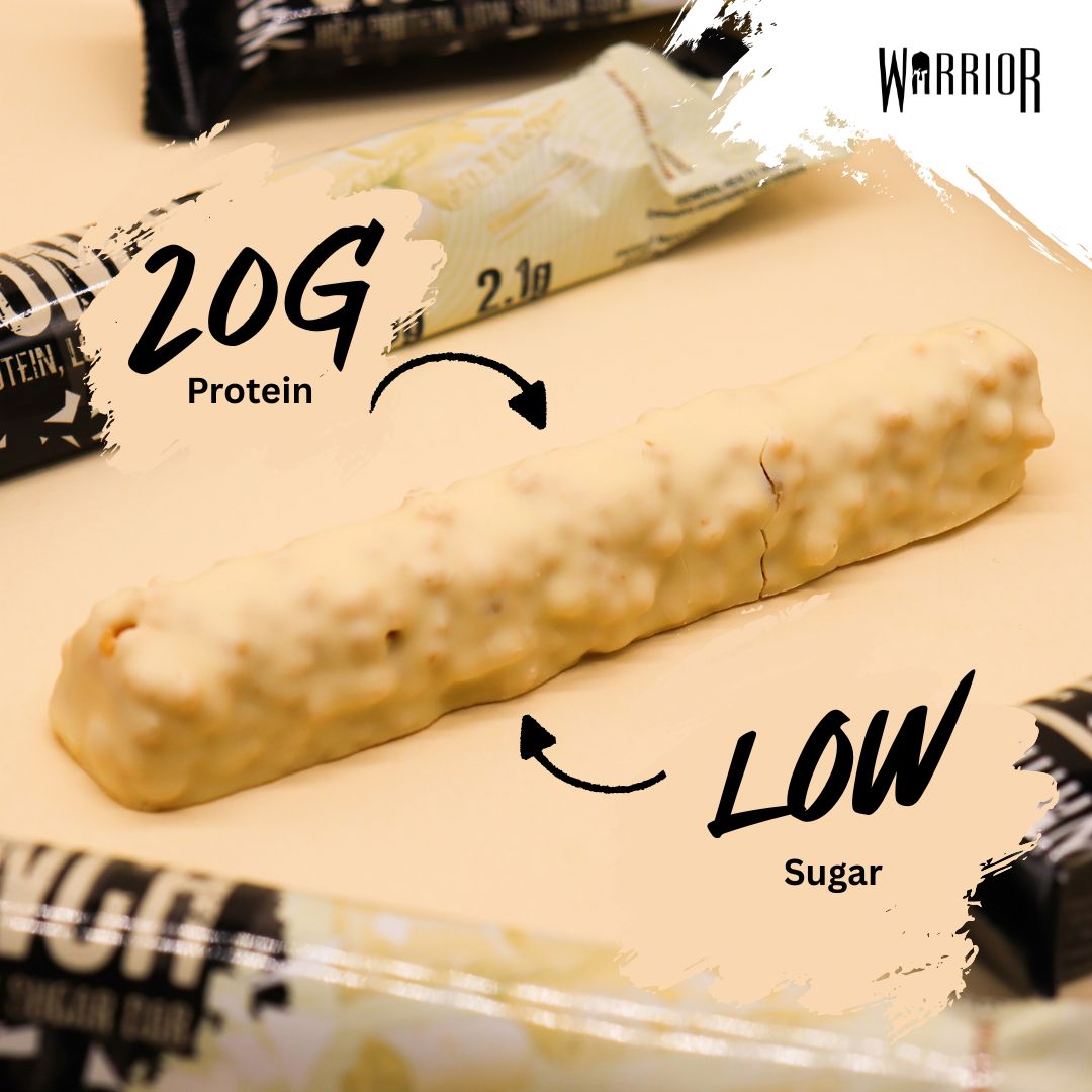 Warrior Crunch White Chocolate protein bar close-up, showing the white chocolate coating with 20g protein and low sugar per-bar callouts.