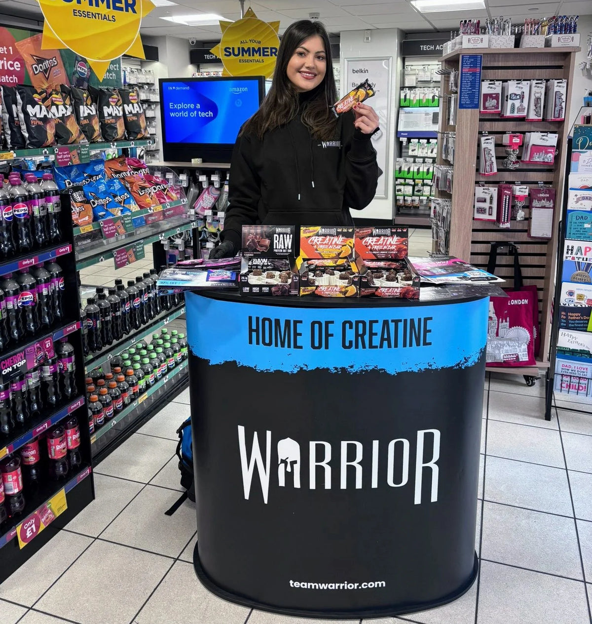 Warrior in-store sampling stand with RAW and Creatine protein bars on the counter